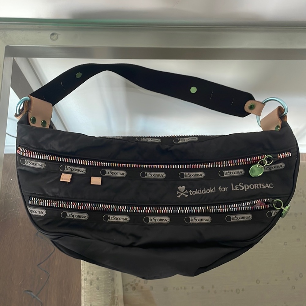LeSportsac x tokidoki shoulder bag with multiple pockets.